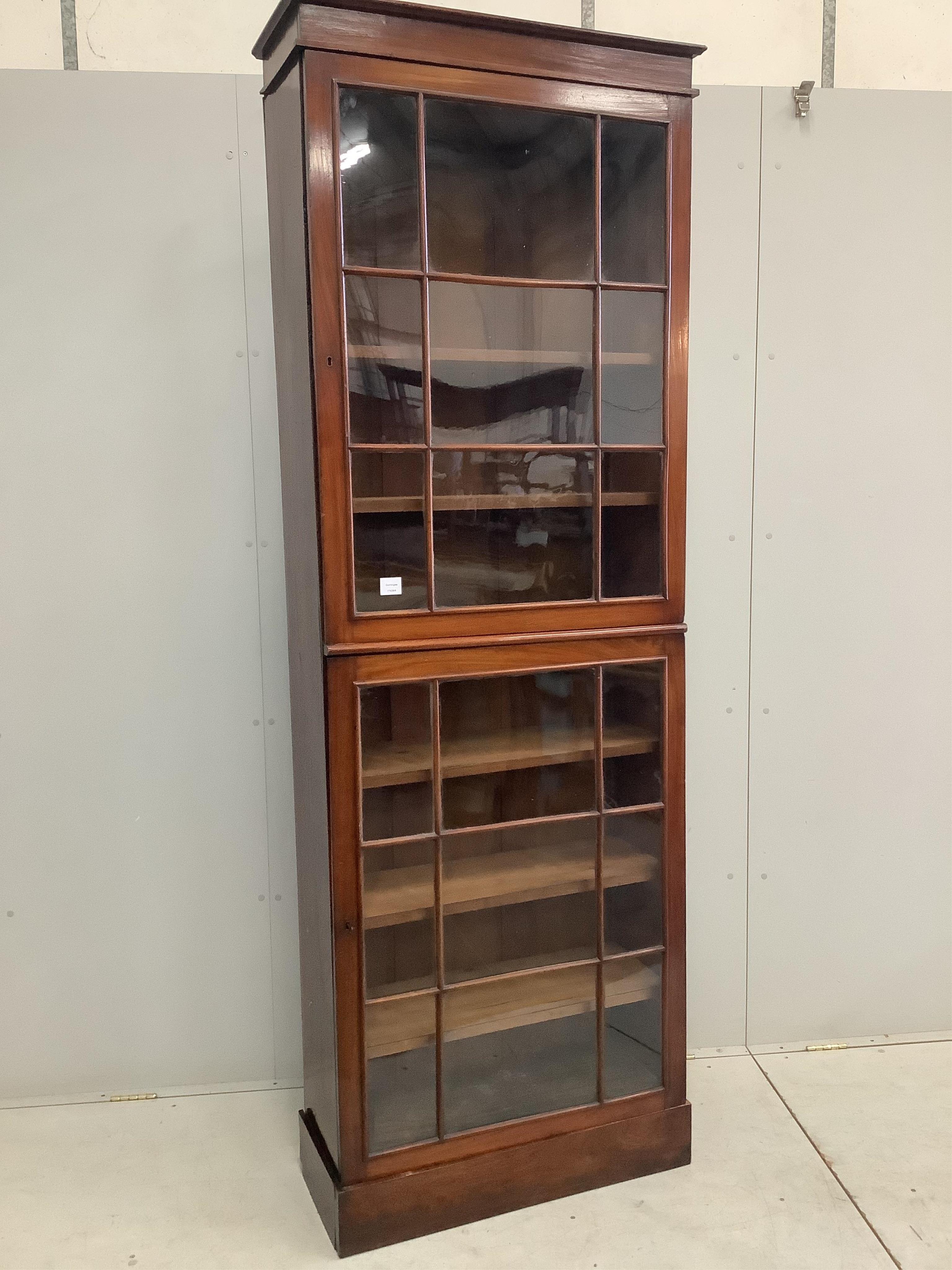 A Victorian mahogany narrow bookcase, width 76cm, depth 32cm, height 230cm. Condition - fair